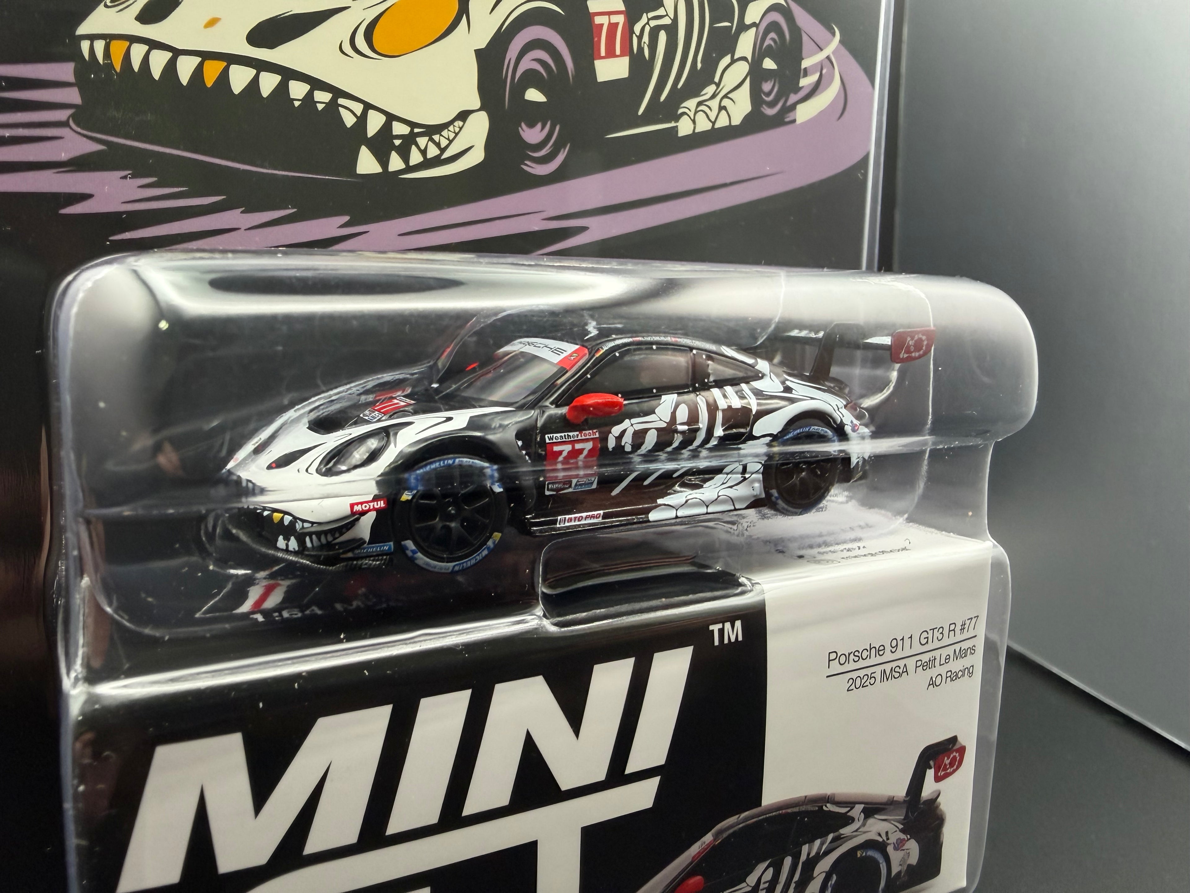 Mini GT Porsche 911 GT3 R “Skeleton Rexy” AO PACKAGING EXCLUSIVE #1143